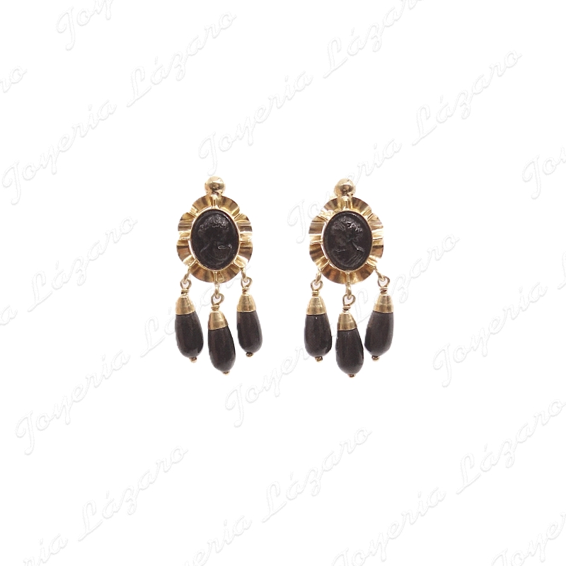 PEND. ORO 18KT SEMINUEVO, 3 CHUPONES NEGROS+CARA ARQUILLO                                           