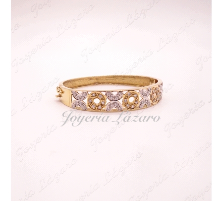 PULSERA 18KTS RIGIDA CALADA BICOLOR CIRCULOS CIRCO,57 mm INT.