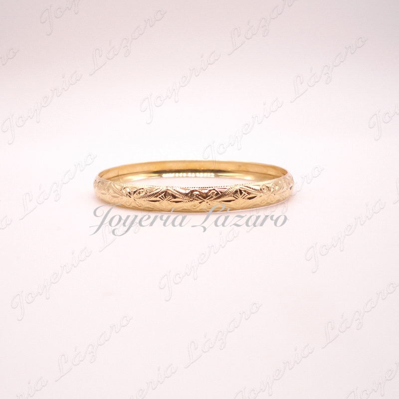 PULSERA 18KTS 1/2 CAÑA RIGIDA TALLADA ANCHO 0.8X6.7CM INT.