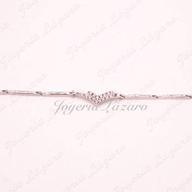 PULSERA 18KTS BL. PIEZAS ESLABONES MOTIVO EN CENTRO CON CIRCO.